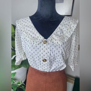 Lauren Conrad | Ruffled collar button-down with navy sewn accents 🤍 🤎